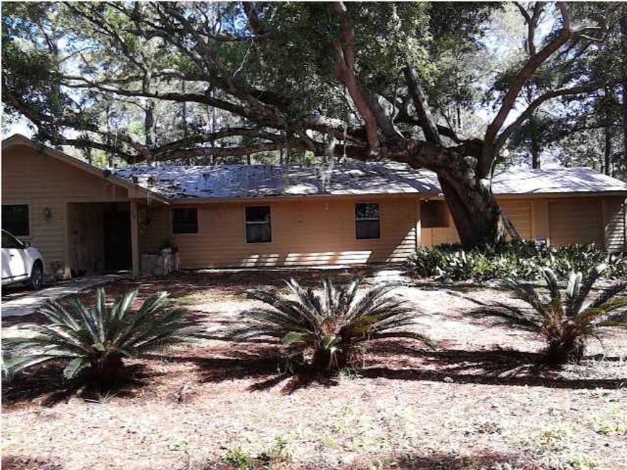 Wow! This house has just undergone a major renovation. The current seller took the inside of the home all the way back to the studs and rebuilt. This home has new sheetrock, A/C ducts, and doors to highlight some of the remodeling. The seller has also added ceramic tile to all the wet areas and she added ceramic (wood look) tile to the living and bedroom areas. The kitchen is brand new with neutral maple cabinets and beautiful granite with an extra deep under mount stainless steel sink. In the living room you will notice the very sleek fireplace and side windows that over look into the back yard. The master bedroom is at the back of the home for added privacy, and the master bathroom features a tile shower. The yard is filled with 100 year old live oaks and massive long leaf pine
