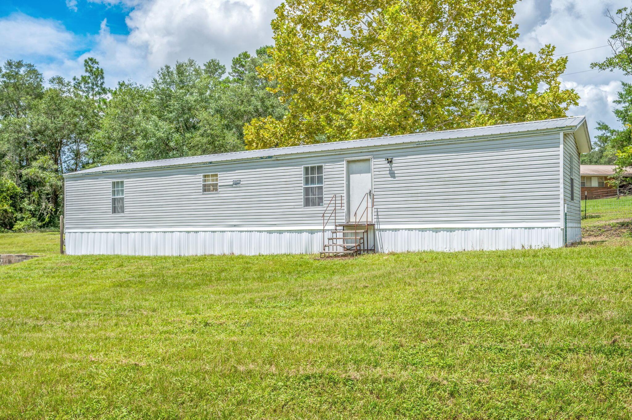 This 2 bedroom, 2 bathroom single wide mobile home sits on a beautiful 2.64-acre lot with a fully fenced yard--perfect for enjoying peaceful country living while still being close to town. The home features a split floor plan, open living area, and washer/dryer hookups for added convenience. With plenty of outdoor space for pets, gardening, or simply relaxing, this property offers privacy and room to spread out. Located just off State Highway 83 N, it's an easy drive to Hwy 90 and local amenities. Pet-friendly with approval--don't miss out on this unique rental opportunity!