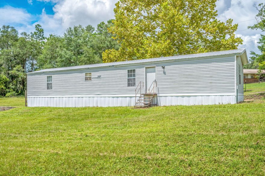 This 2 bedroom, 2 bathroom single wide mobile home sits on a beautiful 2.64-acre lot with a fully fenced yard--perfect for enjoying peaceful country living while still being close to town. The home features a split floor plan, open living area, and washer/dryer hookups for added convenience. With plenty of outdoor space for pets, gardening, or simply relaxing, this property offers privacy and room to spread out. Located just off State Highway 83 N, it's an easy drive to Hwy 90 and local amenities. Pet-friendly with approval--don't miss out on this unique rental opportunity!