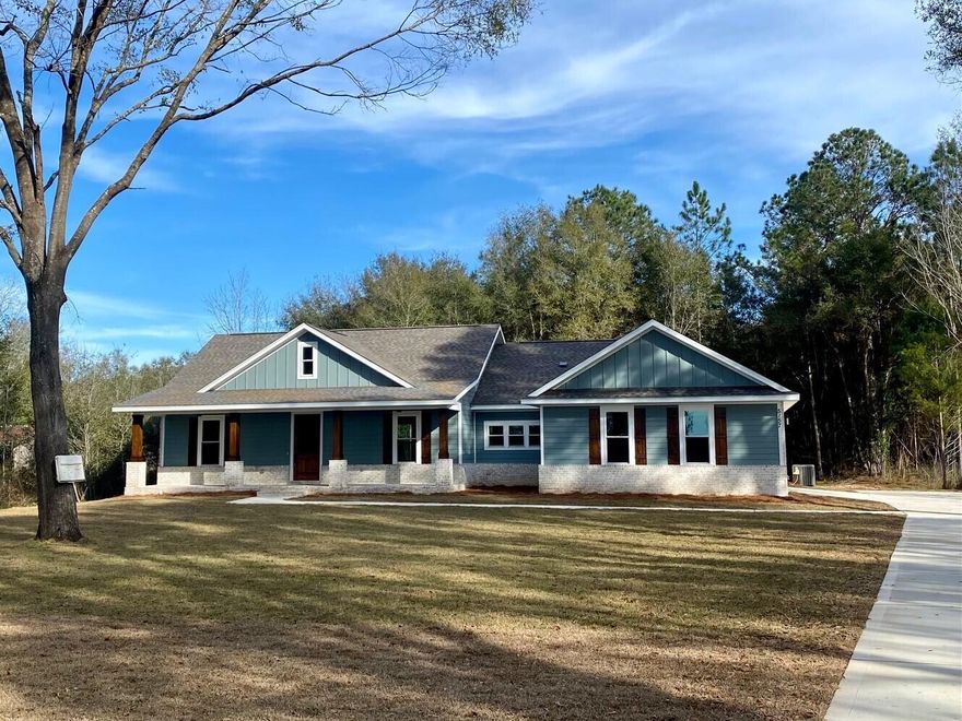 WELCOME HOME! This one-of-a-kind custom-built home on nearly 5 acres boasts 4 bedrooms, 2.5 baths, and 2524 sf of living space, to include an office/flex room. The thoughtfully appointed layout features open concept living and split floor plan. The kitchen showcases a 4 x 8-foot center island, granite countertops, shaker-style soft-close cabinetry, tile backsplash, hood vent over the range, and huge pantry with built in shelving. This home enjoys high ceilings throughout, including vaulted ceiling with wood beam in the great room. Hand-crafted barn doors adorn the office and master bathroom entryways. Durable luxury vinyl plank flooring throughout the home