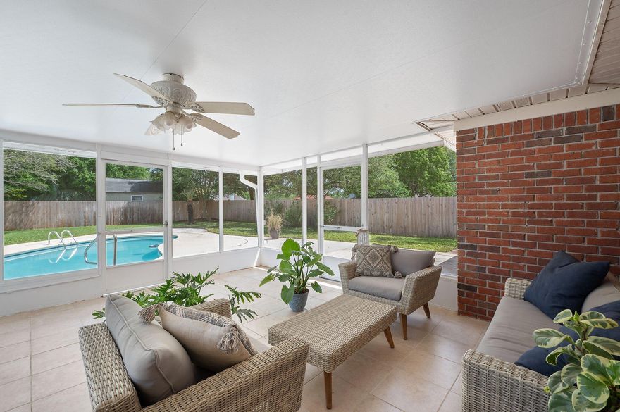 BEST POOL PURCHASE ON THE MARKET! Only reason for the extremely low price is due for a quick sale!!!! Very desirable property tucked away near the golf course in West Navarre. This all brick home features an oversized Florida room overlooking the pool. The privacy fence will give you the seclusion that you desire for your new property. There is mature landscape in the front and backyard that gives fantastic curb appeal. The home features a split floor plan that has a wood look tile and only 3 of the rooms have carpet. Currently the formal dining room and some of the spare bedrooms are used for music lessons and storage so you won't see all of the photos online. It's a very clean and tidy home so it's a must see in person!!