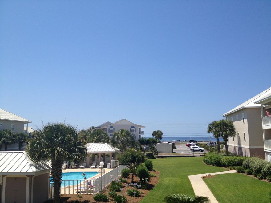 Gated Community with unobstructed Gulf Views!Gulf facing unit on second floor with garage underneath plus large locked storage closet. Elevators in complex!This is truly a condo you can LIVE in full time! Kitchen is huge with over sized raised breakfast bar and white cabinets. Large walk in laundry room with full size W/D. Covered deck off family room and master suite. Gulf front master suite with walk in closet, double vanity and dressing area. Crown molding in master and main living areas.Scenic Gulf Drive has biking and walking paths across from the Gulf for miles! Come enjoy the beach lifestyle!