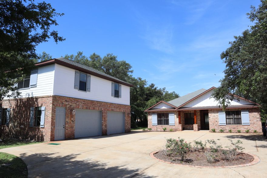 REO-Here is a full one acre waterfront estate in Destin situated on a high bluff with amazing views! Follow the long, winding, tree lined driveway to this hidden craftsman style mansion and carriage house. The main house has three bedrooms and a large office that could be a fourth as well as a large den/media room and an open floor plan for the living, dining, and kitchen area. The carriage house has a complete one bedroom apartment with a full kitchen. However, the beauty is out back on the enormous back patio with a pool and covered entertainment area that has its own full bath and set up for 8 separate tv's. The dock is shared with the neighbor for deeper water. A boater and entertainer's dream. Occupied. View by Appoint Only.