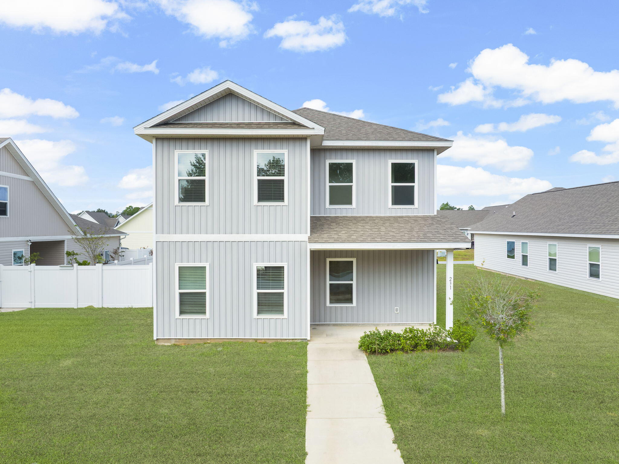 Like new, 4 bed, 2.5 bath single-family home in Freeport, FL w/Fenced Yard and 9' ceilings. Sitting directly across the street from a 7+ acre greenspace park, featuring a walking path, trees and large grass areas to play, picnic and more! This modern home features 9' ceilings throughout, updated appliances, LVP flooring in kitchen, dining and living room, and plush carpet in bedrooms, plenty of storage closets, first floor master, double vanity sinks in both full baths, additional living room (14'x13') upstairs, dual zone AC, covered patio and porch, garage, and long driveway. Video tours available to send upon request.$10,000 Flooring credit and/or closing costs provided!