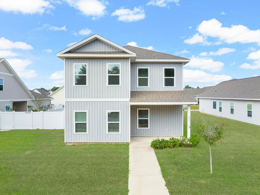 Like new, 4 bed, 2.5 bath single-family home in Freeport, FL w/Fenced Yard and 9' ceilings. Sitting directly across the street from a 7+ acre greenspace park, featuring a walking path, trees and large grass areas to play, picnic and more! This modern home features 9' ceilings throughout, updated appliances, LVP flooring in kitchen, dining and living room, and plush carpet in bedrooms, plenty of storage closets, first floor master, double vanity sinks in both full baths, additional living room (14'x13') upstairs, dual zone AC, covered patio and porch, garage, and long driveway. Video tours available to send upon request.$10,000 Flooring credit and/or closing costs provided!