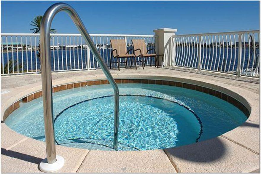 Beautifull END UNIT ON A 16 story building on the water. GORGEOUS WATERFRONT on the East side with VIEWS of Sunrise as well as the sound and the gulf! Community Pool,hot tub, fitness center, guest quarters, and media room. You have two parking spots in covered garage where you are protected from the weather, come rain or shine. It also comes with 2 storage units. Top of the line Kitchen Cabinets-Thomasville, Granite countertops, crown molding, Trey Ceilings, and the Master bedroom has glass doors that allow you to access your balcony as well as enjoy the beautiful view. Master Bath has his/hers vanities, whirlpool tub, a private water closet.