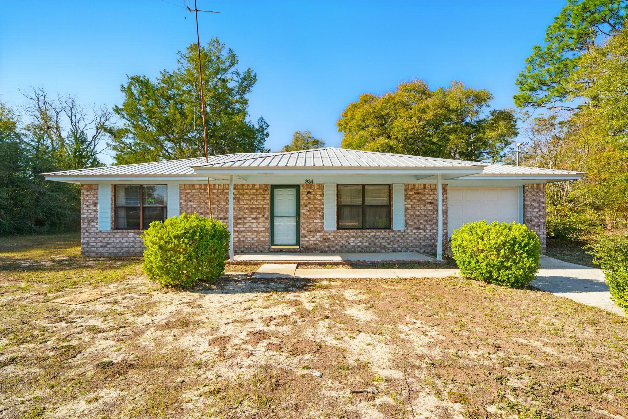 VACANT! EASY SHOW! NO HOA! Looking for that quaint 3 bedroom home with plenty of privacy in a country setting? Here you have found it, sitting on 2+ acres with privacy abound and move in ready. This brick home features a low maintenance metal roof, 3 spacious bedrooms, large patio, and plenty of space for a possible addition, exterior updates, garden, farm life and more! Call today to schedule your showing! All information deemed correct, but Buyer to verify any important details.