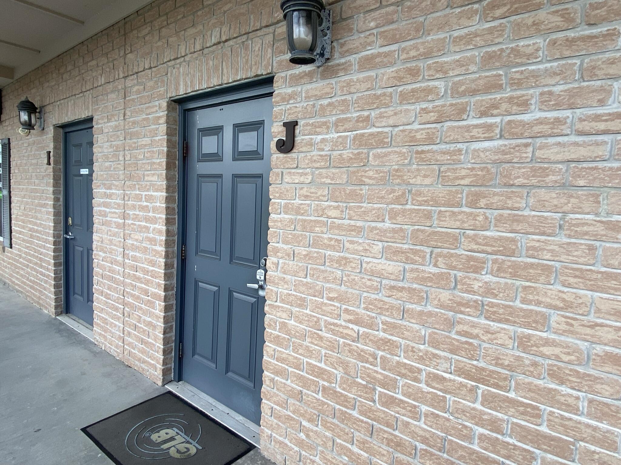 2nd floor office unit. Superior construction - structural steel with brick and standing seam metal roof. This executive office space offers an upscale feel with 5 spacious private offices, a reception area, a kitchenette/break area, and a restroom. This office space is also hardwired in each room for data, cable, and phone lines, making it turn key. Located in a high traffic location and centrally located for maximum convenience, this commercial office space also features an elevator, exterior signage and ample lighted parking.