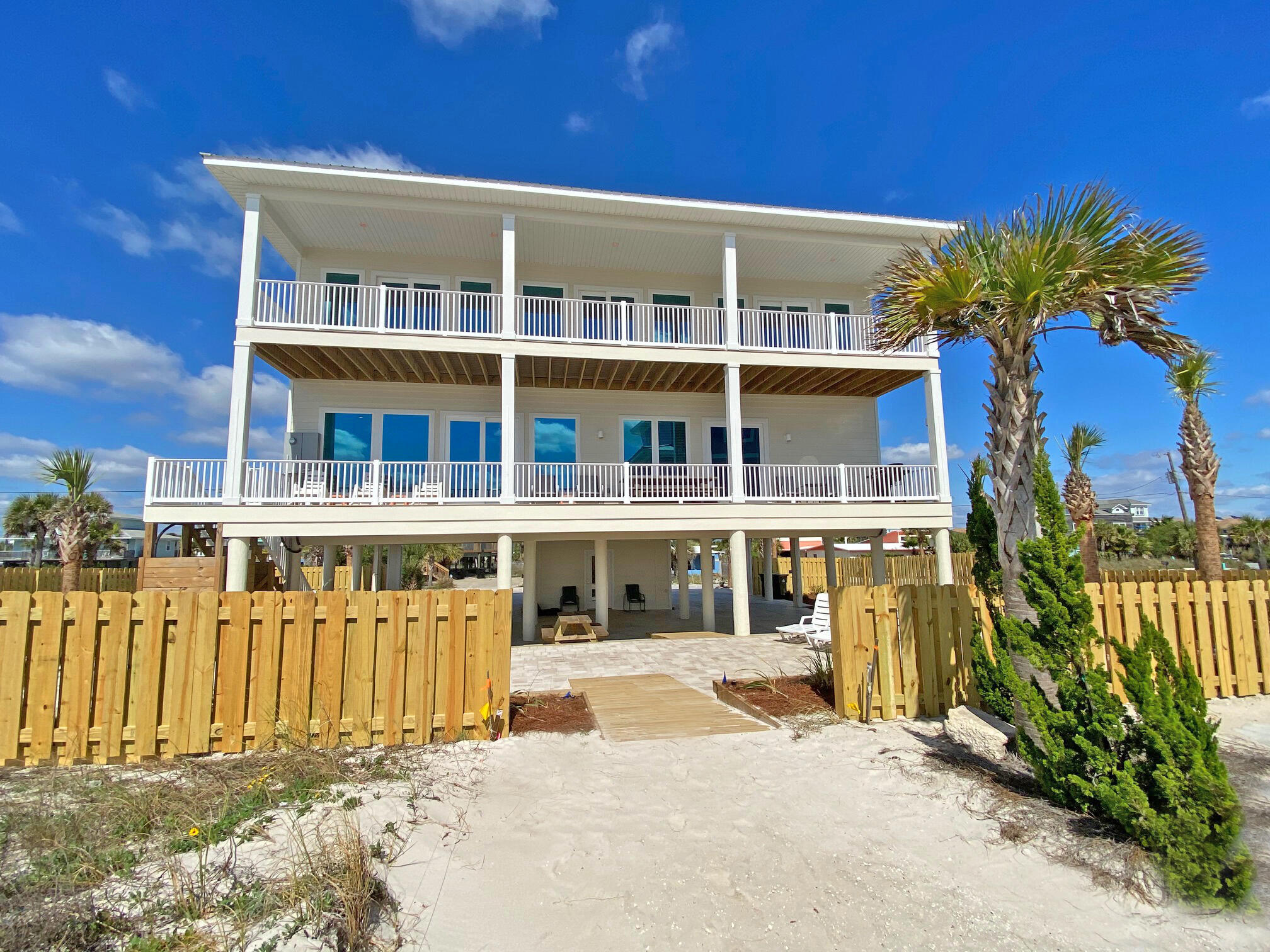 Experience the coastal paradise that is Pensacola Beach in this contemporary, luxury home with incredible views of the Gulf from every room. Pensacola Beach and The Gulf Island National Seashore have been discovered over the past few years and continue to garner national recognition as one of the most beautiful beaches in the country. Upon entering this beautifully designed home the views of the sugar white beach with the waves breaking along the shore soothe the senses with calm serenity. The entire house is accessible by stairs and elevator. The yard is landscaped with palms and local plants surrounding a large patio with pavers. There is abundant parking. This luxurious turn-key Gulf-front property will be a wonderful primary residence, second home, or successful vacation rental.