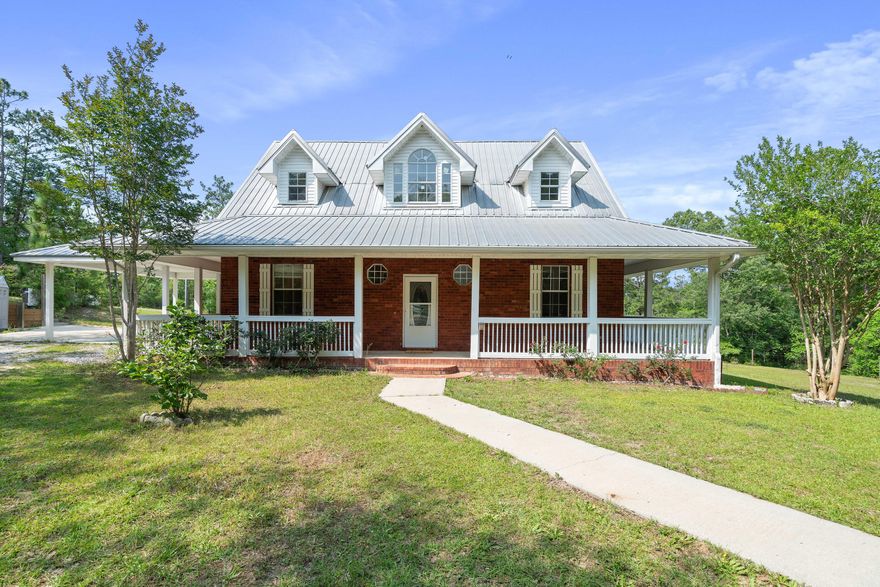 Come view this amazing brick home with an above ground pool that sits on rolling 25 acres just a short drive from all the amenities of Defuniak Springs and approximately 40 minutes to some of the most amazing beaches in the US.  The kitchen has two ovens (a bakers dream), cooktop and under cabinet lighting.  The downstair has a breakfast room and a formal dining room and a half bath.  The primary bedroom is on the ground floor and has a walk in shower and an amazing tub.  The family room has a gas fireplace with an amazing custom beamed ceiling.  Their is an amazing wrap around front porch that gives a perfect view of all the wildlife present in the area.  Their is a sunroom overlooking the pool.  There is also a 40x60 barn on the property.