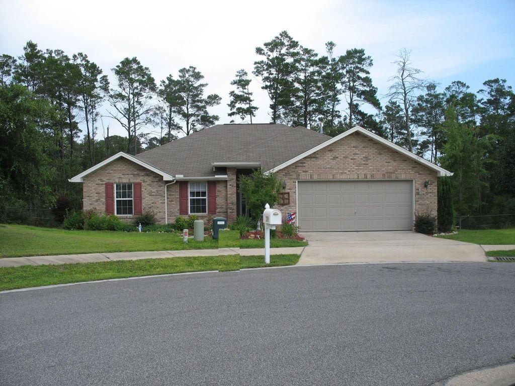 This beautiful home is located on a quiet cul-de-sac near Northwest Florida State College and 5 miles to the East gate of Eglin AFB. The house features raised ceilings in the Great Room with a beautiful gas fireplace. Light and bright eat-in kitchen with island, and Formal Dining Room or Office Area. Wonderful Master Bedroom with vaulted ceiling and walk-in closet; Master Bath has double sinks and separate Garden Tub and shower. Natural gas generator with 110 electric hookup installed in garage. Beautifully landscaped yard with Automatic Sprinkler System. Close to Edge Elementary, walking distance to Ruckel Middle School, Niceville High, and Niceville Public Librar