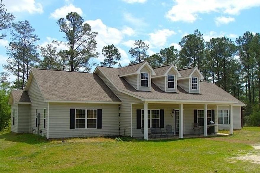 BEAUTIFUL HOME, 10 ACRES AND A CREEK! -- Don't miss out on this lovely 4 BR, 3 BA custom home situated on 10 gently sloping acres. High banked Turkey Creek runs through this property, and there's plenty of wildlife around. The pretty home features slate, tile, and laminate flooring, a split floor plan and a spacious master suite. With four bedrooms and three baths, there's plenty of room for the kids AND visiting relatives. Come enjoy the best of country life in a beautiful custom home. The yard is huge and features a large pole barn for all your equipment. The majority of the acreage is wooded . A path has been cleared to beautiful Turkey Creek, which attracts wildlife galore. This one is a must see! All measurements and acreage to be verified by buyer at buyer expense.
