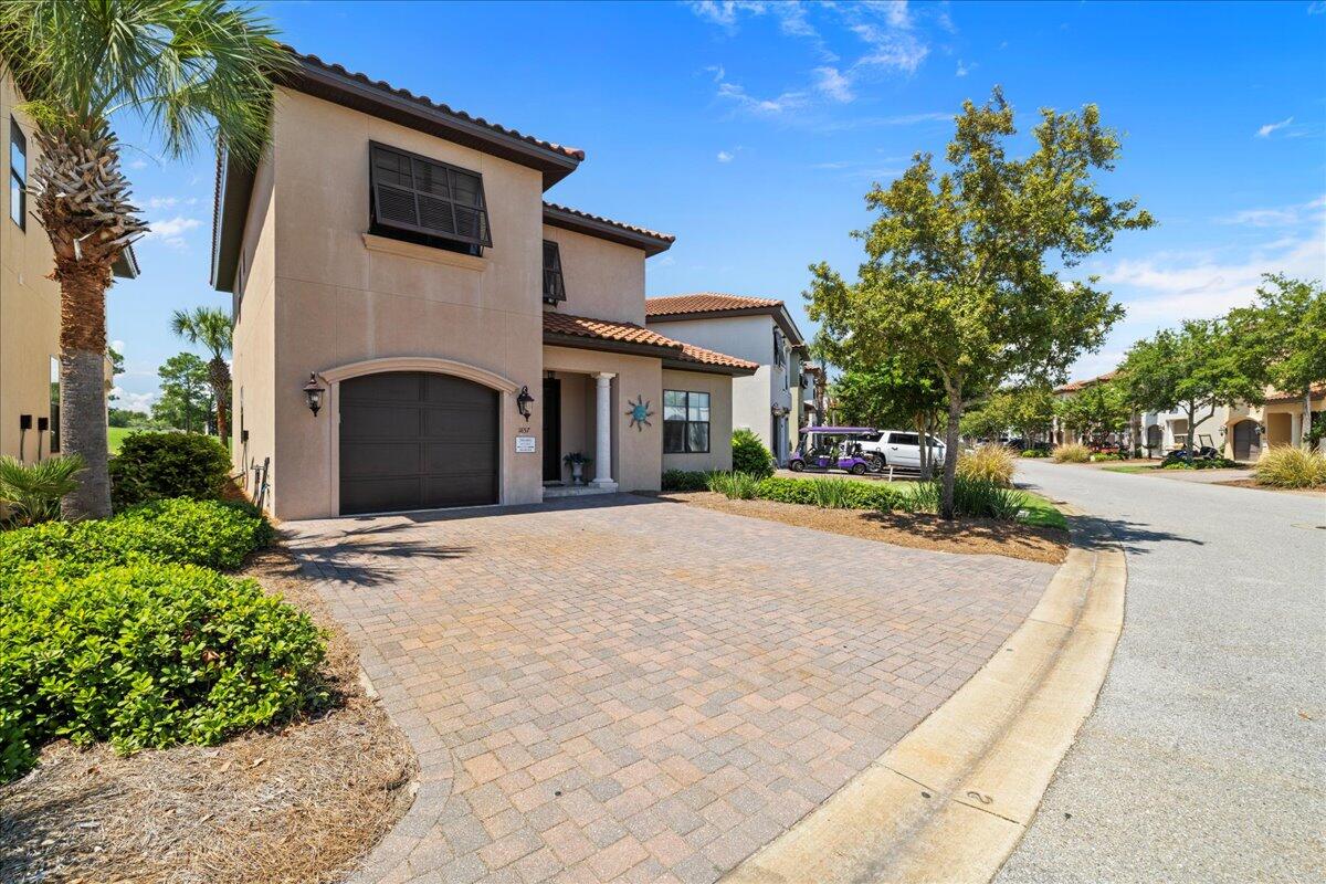 Tee off in style with this stunning home on the #5 fairway of the Baytowne Golf Course. Enjoy sunsets and fireworks from your private patio and balcony. Featuring a convenient master suite on the main floor and an open concept living/dining area complete with a chef's kitchen and coffee bar, this home is designed for both comfort and entertainment. Upstairs, find a second living area, another master suite, and two more bedrooms with en-suite baths. Perfect as a primary residence, second home, or vacation rental, this fully furnished coastal gem includes a garage and two golf carts. Swing into your dream lifestyle today!