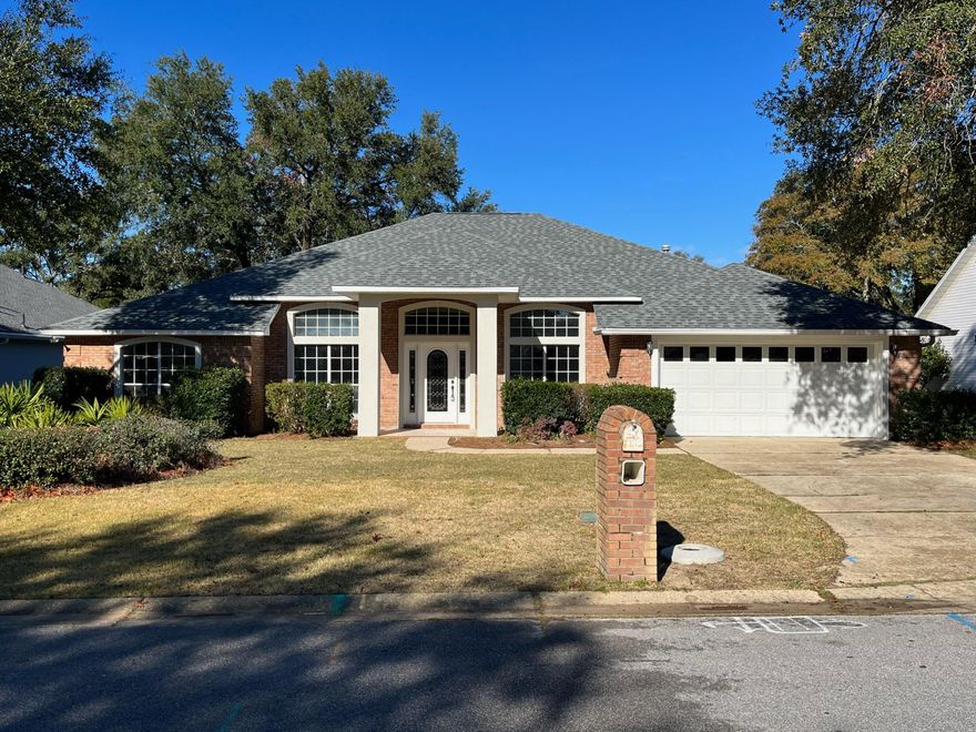 Sporting a new roof, new power panels, new lawn pump, and new landscaping, this home is ready for a NEW OWNER!!!  Located inside the highly desirable, guard-gated Bluewater Bay community of Southwind find this spacious 4 bedroom, 3 bathroom, all-brick home with immeasurable potential. Enjoy a popular and highly functional split bedroom layout with an open concept living, dining, and kitchen area at the heart of the home, as well as a formal dining room and flexible office flanking the entry foyer. The covered, screened back porch leads to the wide, usable yard with plenty of room for a future pool overlooking the fairway.