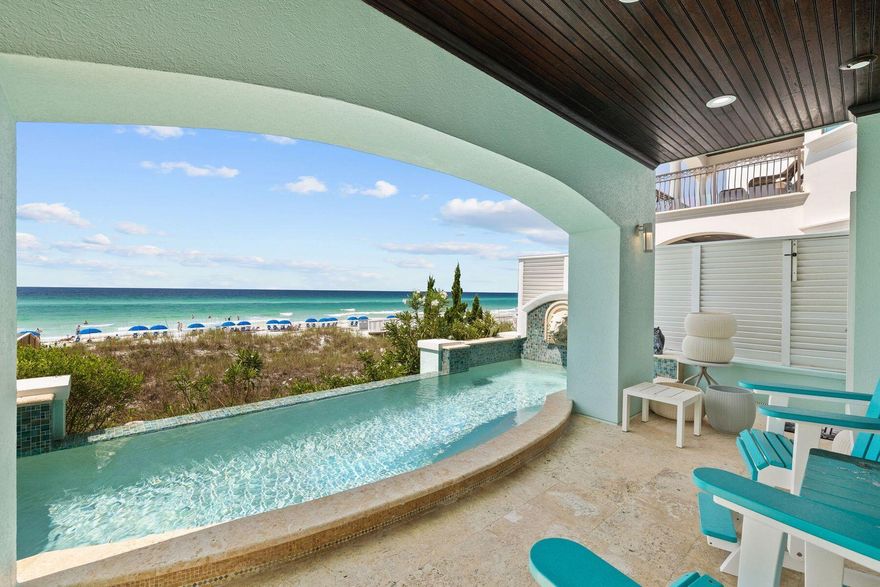 This luxury gulf-front beach house in Destiny by the Sea offers the possibility of being a short-term rental, second home or primary residence. Impeccably maintained and beautifully presented, this expansive Mediterranean-inspired property has a two-car garage and a private courtyard entrance. Inside, it is tastefully appointed with new furnishings and decor to complement the all new exterior paintwork and stucco. The foyer makes a grand opening statement with a saltwater aquarium, elevator and stunning metalwork balustrade edging up the curving staircase. The reverse floor plan puts the main living area on the second floor, delivering magnificent beach and water views. The custom kitchen is perfect for those wanting to indulge their culinary skills. The spacious center island has tons of cabinetry and storage beneath the stepped granite countertop. Bar stools are lined up ready for happy hour drinks and snacks. An eat-in breakfast nook provides the perfect place to start each day with a healthy breakfast while making plans for the day's activities. There is also a private office space located on the second floor. The first floor of this legacy property has a generous two-car garage and additional living space along with a private bedroom suite. It also provides direct access to the infinity-edge pool, sun deck and pool bathroom. The well-placed kitchenette provides a useful area for serving cold drinks and snacks poolside. The third floor is the domain of the primary bedroom suite that extends onto a curving private balcony. Grab coffee from the coffee/wet bar area and enjoy a moment of quiet solitude before the day unfolds. The enviable master bath is encased in marble with a soaker tub, his-and-hers vanities and a separate marble-tiled shower. Two further guest bedrooms have their own private baths. A laundry room rounds off the third floor. The elevator accesses all floors including up to the rooftop. The rooftop is complete with plenty of lounging and entertaining space and a half bath. It's the perfect place for entertaining, dining and private sunbathing while savoring breathtaking gulf views. On this level, there is also a flexible bonus room. Just a few notable features and updates include a Lutron lighting system throughout, security system, a water filtration system, new HVAC units, water heaters and Generac Generator and  a whole-home audio and WiFi system. Steps from the sand with 50 feet of linear beach frontage, this is the ultimate vacation home or investment property. This upscale gated community offers the reassurance of patrolled security along with a clubhouse, community pool and beach chair service.