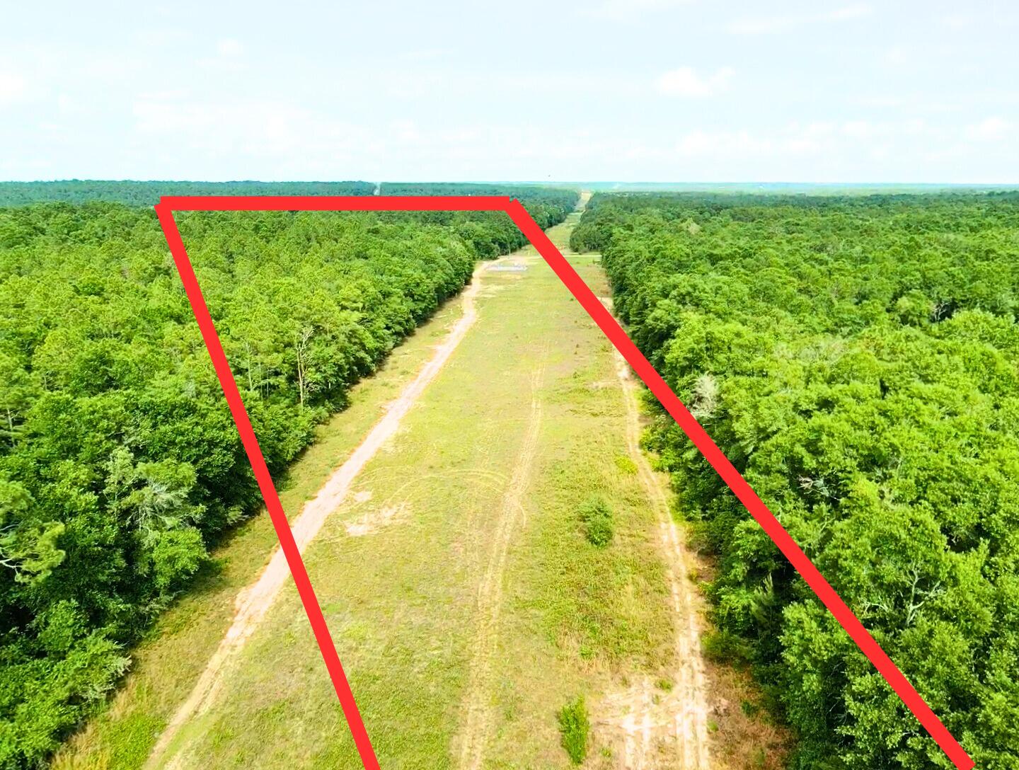 Looking for an ideal homesite for building your dream home, or your real estate investment property??? Discover 7.93 acres homesite on Lake Ella Road, in Northeast Crestview, FL -- A perfect blend of privacy and convenience. This spacious parcel offers an easy commute to several military bases, located just under 35 miles from Eglin Air Force Base, and 23 miles from the 7th Special Forces Group. Everyday essentials are within reach, with Dollar General located only 6 miles down the road, and Walmart-Crestview just 15 miles away. And... when it's time for sandy toes and coasty waters, the stunning emerald beaches are only 41 miles from your home sanctuary!