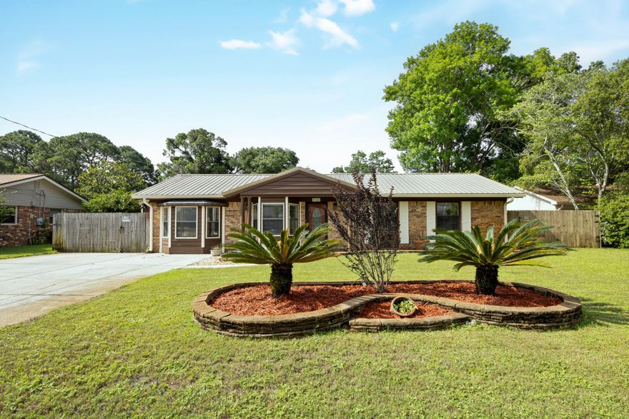 Back on Market-No Fault to Sellers! Look no more, paradise right in your own backyard! Enjoy this newly updated home, beautiful inside and out! The remodeled kitchen features granite countertops, brand new stainless steel appliances, farmhouse sink, ample counter space and plenty of cabinet storage. Vaulted ceilings in the living room make the space feel extra big and you will stay cozy during the winter months with the electric fireplace. Other updates include new ceramic tile flooring throughout the home (excluding bedrooms), brand new beautiful master bathroom, 2017 metal roof, 2017 water heater. Step outside to a large fenced in back yard with low maintenance landscaping and