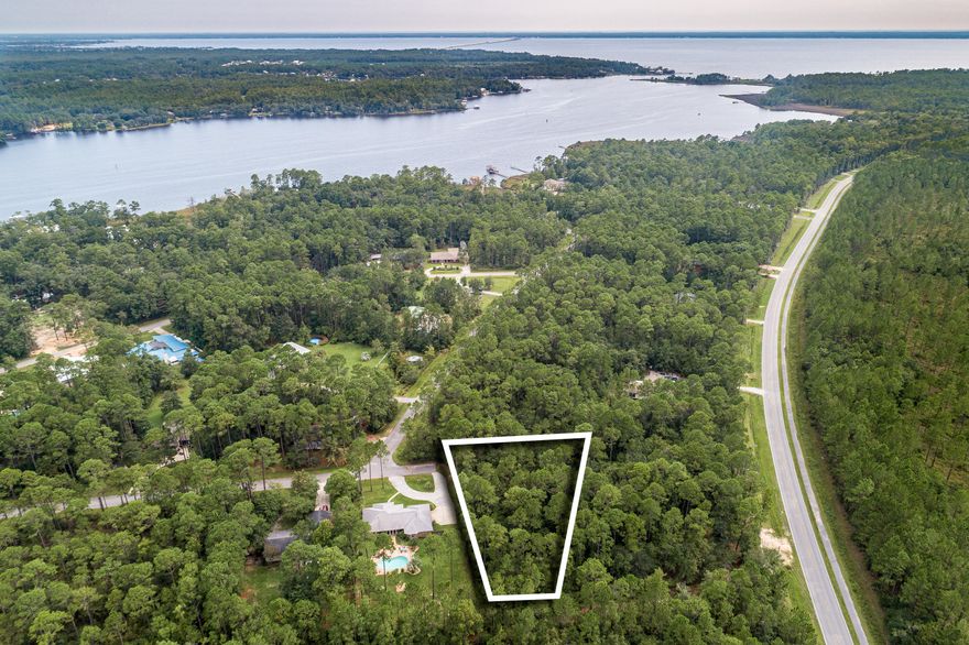 Large corner lot located in LaGrange Shores an up and coming community. This subdivision has no HOA or fees. Just a short 15-20 minute drive from Hwy 331 to the beautiful beaches on 30A. There is a marina located just up the road for launching and gas as well. Great opportunity to build your home in one of the fastest growing communities in Walton County.
