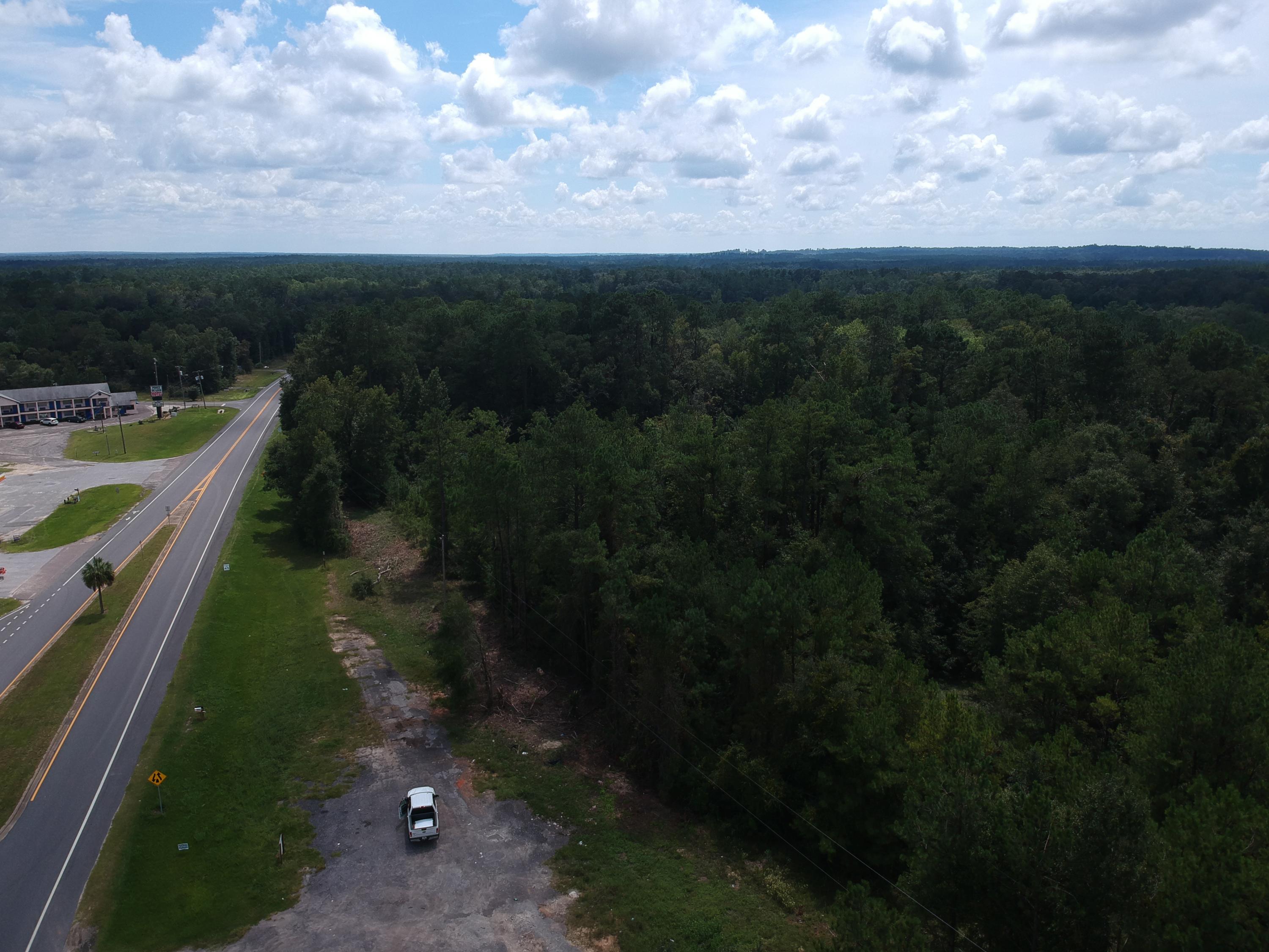 AWESOME LOCATION! almost 3 Ac Zoned commercial, that approx 800 feet of highway frontage, 4 lots total, Just off Interstate 10 right across the street from State of Florida rest area, 3 gas stations and a hotel. Nice traffic count at this I 10 exit #96. Paved area for parking already there. This would make a great location for a Dollar General, or a fast food place like McDonalds, Burger King, Hardees. Or a business office that wants to be centrally located between Tallahassee and Pensacola. You wont find a PRIME real estate location just off an interstate for this price. An Investor might pick this up and hold as this area continues to grow!! PI# 1834.02-001-013-001.000, 1834.02-001-017-001.000, 1834.03-001-020-001.000 and 1834.03-001-020-002.000