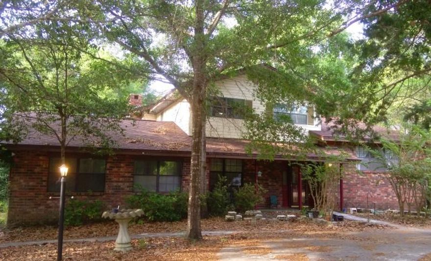 LOCATION! Less than a mile to Eglin East Gate, perfect for kayakers! Amazing location for Eglin AFB! Walking distance to the gate! Ideal location for kayakers, hikers, outdoor enthusiasts. Surrounded on three sides by Eglin federal wildlife reserve. Backs up to undeveloped city property with access to Tom's Bayou. Vacant & ready for move-in mid-May! Split-level property with three bedrooms and two full bathrooms upstairs, one very large bedroom and half bath on the main level. Separate office, two living rooms, formal dining room, eat-in kitchen, sunroom and sun deck. Master upstairs has a walk-out balcony overlooking undeveloped city property and Tom's Bayou. Carpet to be replaced mid-May. Needs landscaping work and indoor painting. Property for sale AS-IS.