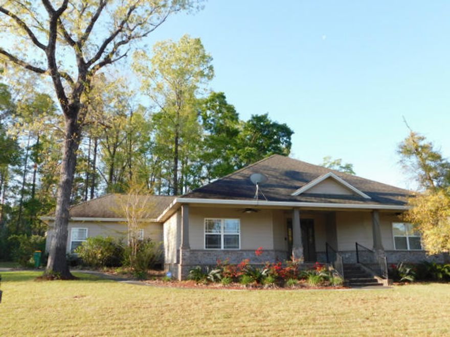 Craftsman style home with a large, covered front and back porch for relaxing and entertaining. Outside you will find there is a privacy fenced back yard, a full in ground sprinkler system, Hardi board siding and brick. The back porch is plumbed with gas for the BBQ and has ceiling fans like the front porch. There is a large side-load garage and ample parking. Inside, the floor plan offers a split bedroom floor plan and is open to the great room and kitchen. The ceilings are textured and have crown molding. The master bedroom has French doors and also doors onto the back porch. The master bath has double vanities and a walk-in shower. The spacious kitchen has granite counter tops and comes with all major appliances.The HVAC system is only 1 year old, and there is mani-bloc plumbing.