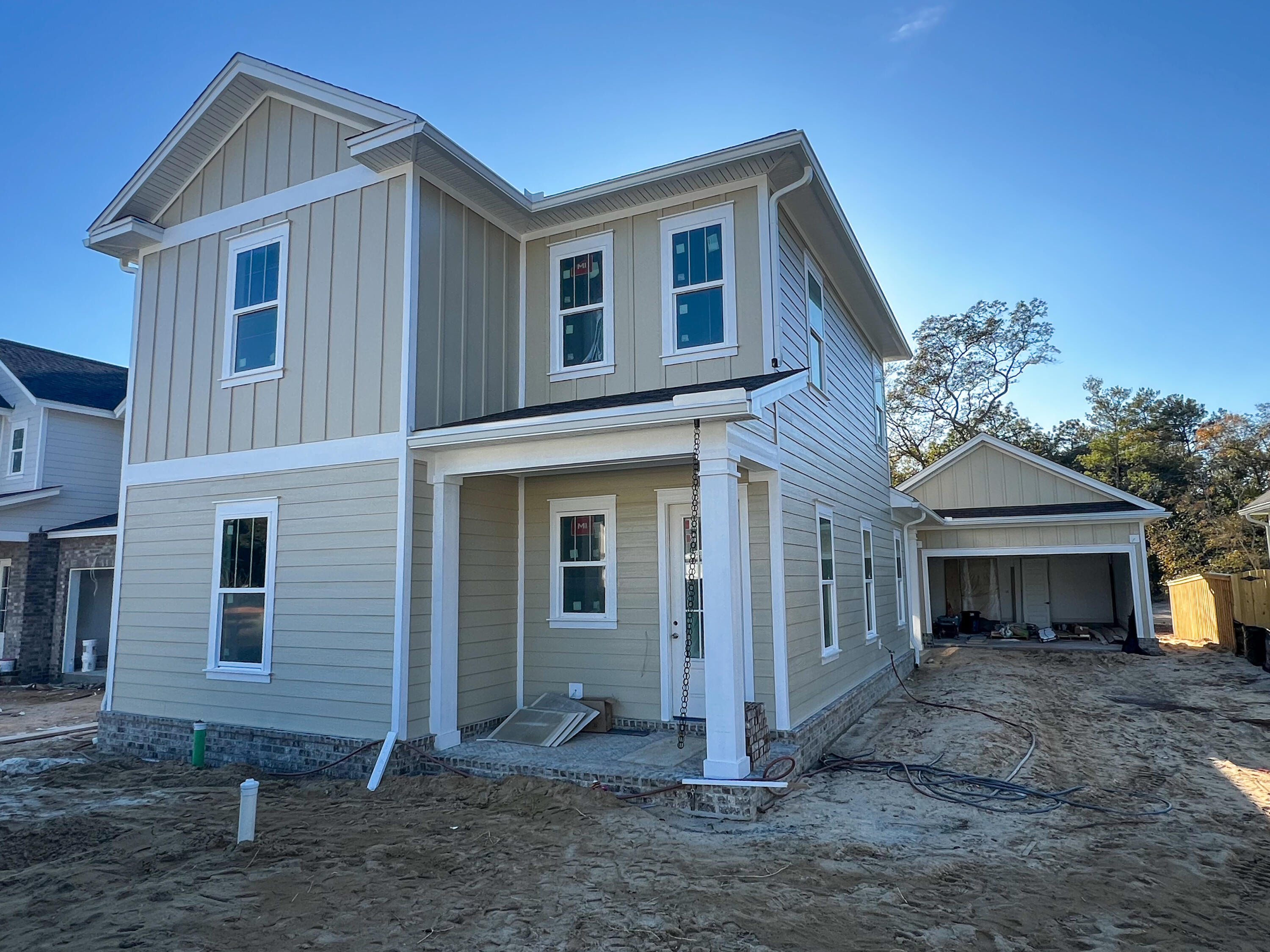 This stunning two-story home, The Magnolia Plan, offers 5 bedrooms, 3 bathrooms, and 2,194 sq. ft. of well-designed living space. The primary suite and one guest bedroom is located downstairs with three bedrooms and a guest bath upstairs. The kitchen shines with white shaker-style cabinets, quartz countertops, and a large walk-in pantry. Durable LVP flooring runs throughout the home with tile in the wet areas. Smart features include a Ring doorbell and Smart Belt garage door opener for convenience and security. The community clubhouse, now complete, offers a pool, playground, and basketball court, providing fantastic amenities just minutes away. Seller is offering $10,000 towards a rate buy-down and an additional $10,000 of anywhere money, plus 1% towards the closing costs!! March 2025