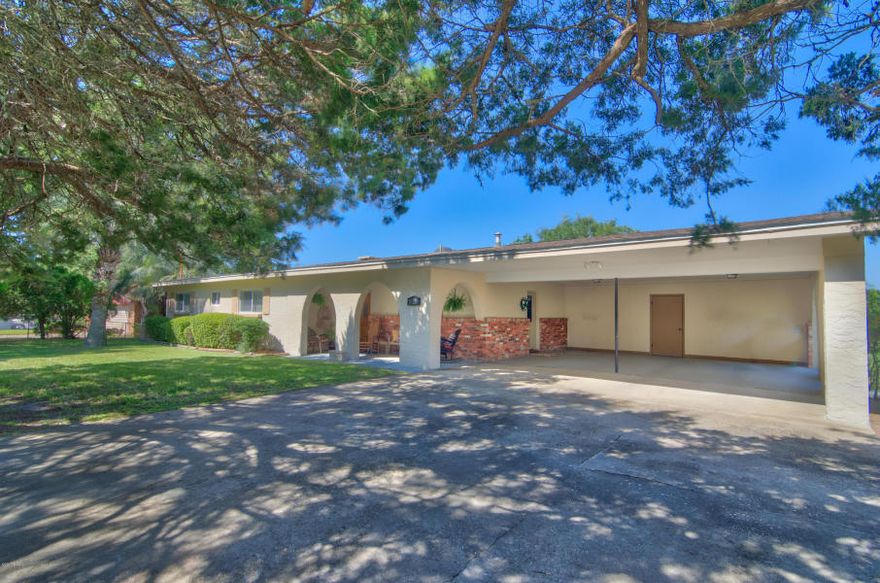 This incredible 2 story ranch style home Has it all! Some of my favorite features include; the cinder block construction, the double lot,the peaceful Lullwater Lake community , large rooms and living areas and the oversized carport and driveway ( plenty of room for your Lake and Beach toys) The downstairs has been remodeled into a remarkable living space which includes another master suite,open living area with fireplace and plenty of additional space. This additional 1100 square feet has many options. The area would make the perfect mother-in-law suite, game room, teenagers headquarter, mancave or she-shed. The possibilities are endless. The location is fabulous. Only a few blocks to the beach, Pier Park & Frank Brown Park. This golf cart friendly community is a wonderful place to live