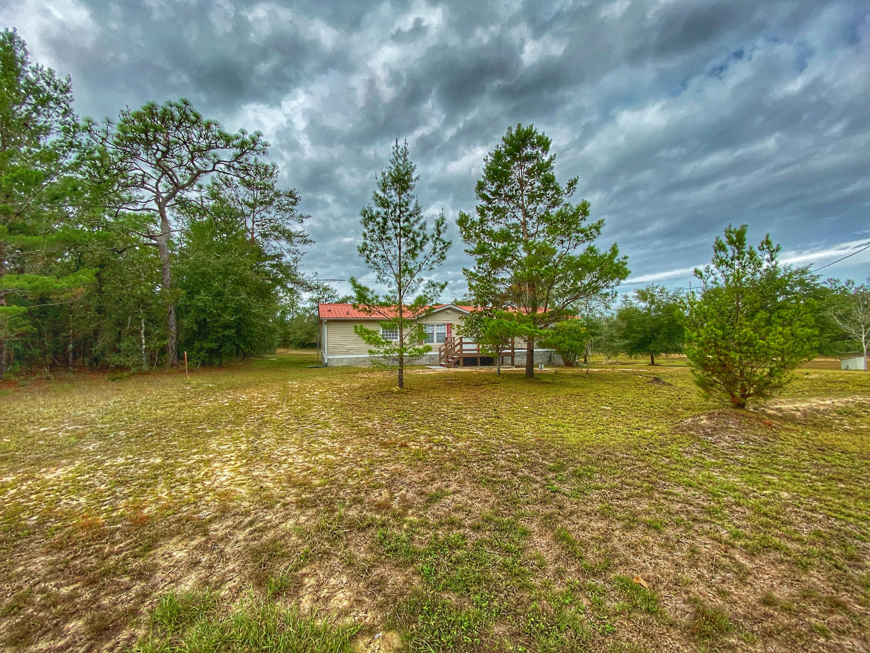 BRING OFFERS! Neat & clean well maintained manufactured home with 3 bedrooms and 2 baths on over an acre of land. Walls have recently been painted and there's a new front porch. This homes also has a basement and security system. Call today for a showing!