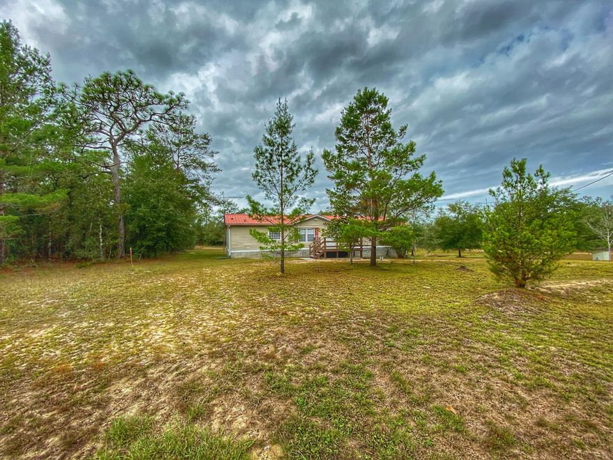 BRING OFFERS! Neat & clean well maintained manufactured home with 3 bedrooms and 2 baths on over an acre of land. Walls have recently been painted and there's a new front porch. This homes also has a basement and security system. Call today for a showing!