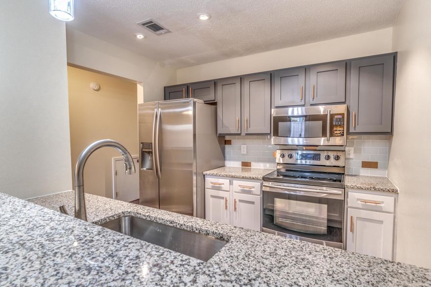 Professional pictures 10.26.18-Stylish and spacious! This townhome overflows with some of the most beautiful touches and features. A newer a.c. was installed less than 2 yrs ago. The kitchen is perfection w/ copper handware and other modern touches. The downstairs level boast a beautiful hardwood flooring. The living room is oversized and is open to the kitchen and allows for the perfect entertaining space. It flows to its own little private yard for relaxation. Upstairs you have two very large bedrooms that each have an attached en suite. Both bedrooms boast walk in closets as well as lots of space. The master en suite has the same beautiful granite that flows throughout the kitchen and downstairs half bath. The best feature is the washer and dryer is upstairs between the two bedroom