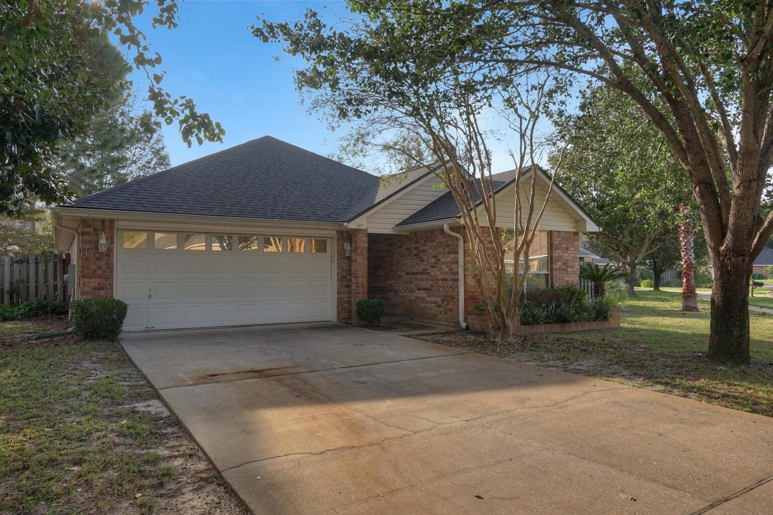 Centrally located in Destin, this 3 Bedroom / 2 Bath has tile flooring throughout, a gas fireplace in the living area and vaulted ceilings. The primary bedroom offers a recently upgraded walk-in shower, double vanity and spacious walk-in closet. The hallway bathroom offers a tub/shower combination. This home features a 2 car garage and a completely fenced in yard. This property is conveniently located within close proximity to grocery stores, retail shopping, the beautiful beaches, and the Destin Harbor. Pets to be considered with non-refundable pet deposit. Available for move in starting July 1, 2025.
