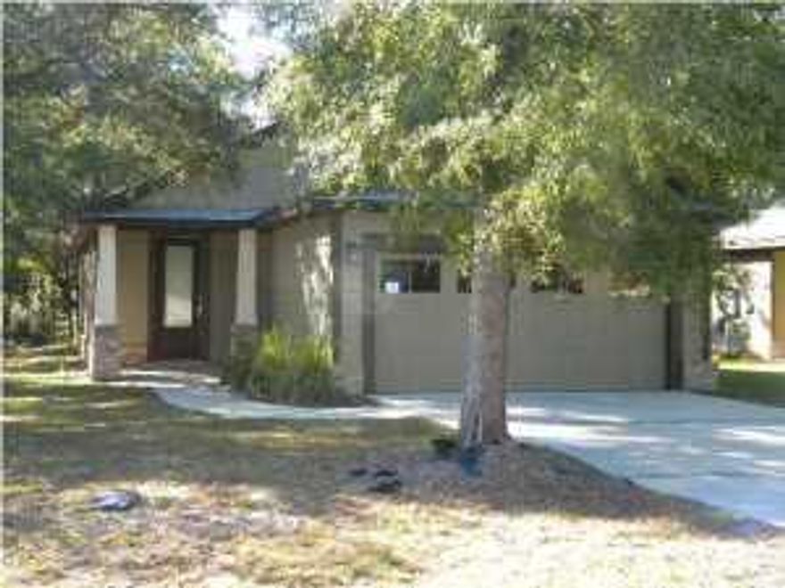 Fantastic 3 bedroom, 2 bath home in The Canopies of Freeport! This home features tile flooring with 9 and 10' ceilings, crown molding, recessed lighting, front and back porches, custom cabinets and countertops and a 2 car garage. The Canopies community has a pool and playground area and is a quiet shaded family neighborhood. Great Home!