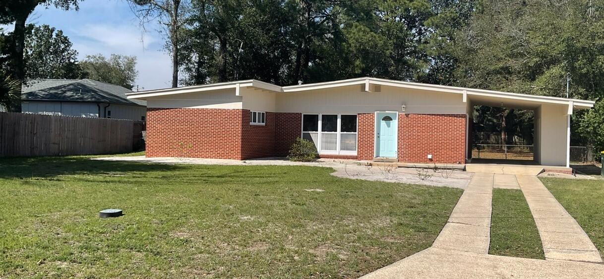 LOCATION! New exterior paint 2024! Exceptional home in the heart of Fort Walton Beach! Close proximity to all of Downtown's shopping, dining, and entertainment and minutes to both bases! This home boasts an open floor plan, a beautiful large brick fireplace, Terrazzo flooring, tons of natural lighting, and an indoor laundry room! NEW HVAC 2022! From your living room, you have a view of the large backyard. Use your imagination and bring the canvas to life! Outside you'll also find three storage areas and a fully-fenced back yard. Make 49 Waynel Circle SE your Fort Walton Beach home today!