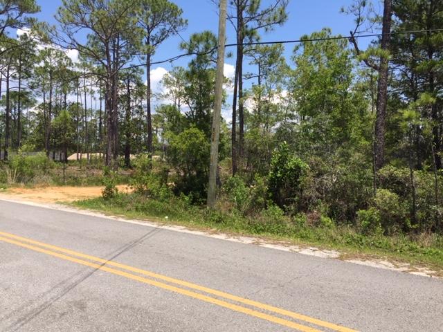 Great location close to Shopping, Banking and Hospital. Wooded lot off Paved Street.