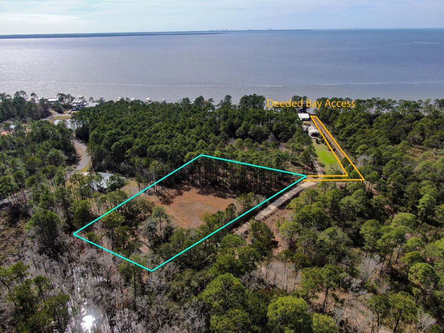 RARE FIND! 2 Acres with DEEDED BAY ACCESS and no HOA or restrictions. Zoned Rural Village with a Future Land Use of Rural Residential. Whether you're buying for today or holding for investment, this could be a wonderful opportunity. Property is mostly cleared, with a 15' wide easement to the bay. There is an old mobile home, well and septic on the property that has been given no value and sellers do not know or guarantee condition. Would make a wonderful estate size homesite. Flood Zone is AE with a base flood elevation requirement of 8 feet.