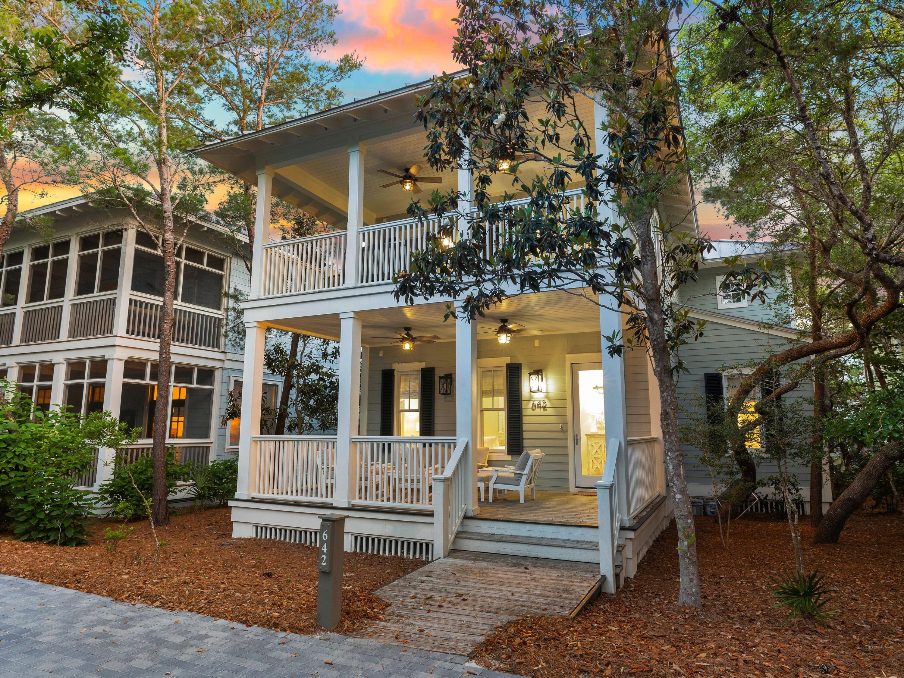 This luxury home in the coveted WaterColor Lake District is just steps from the exclusive Beach Club. It delivers the highest level of luxury living after extensive remodeling by renowned custom builders, Borges Brooks. Soothing pastel decor, tall windows and custom artwork set the scene for the laid-back living space. Gleaming flooring adds warmth to the pristine living room, connecting the bright sitting/TV area with the dining area and beautifully remodeled entertainer's kitchen. High-end stainless steel appliances and a large breakfast island provide the perfect place for welcome cocktails and gossip beneath the seagrass pendant lighting.