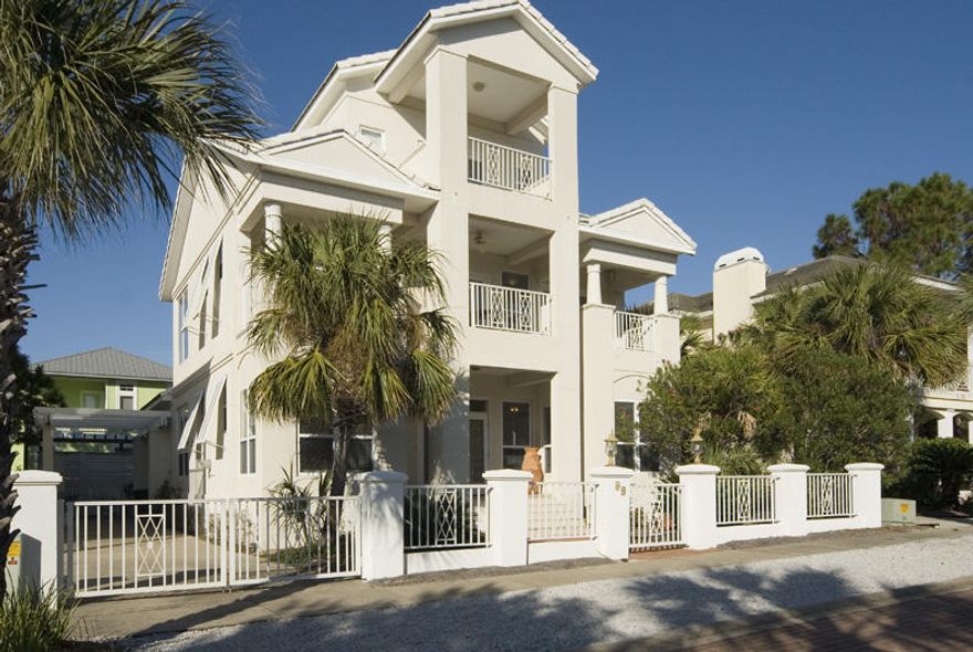 PRICED TO SELL, Exceptional VALUE for south of 30A, steps to the beach! This family beach home in the gated neighborhood of The Village of White Cliffs in Blue Mountain Beach offers views of the Gulf from its third-floor covered porch. The open concept ground level features tile floors throughout as well as a voluminous, double-height ceiling in the kitchen and dining room areas. The living room area features a gas fireplace and sunny, window-wrapped sitting area at the front of the home for a game table or casual dining set. Having a single bedroom on the ground level is a luxury and this home offers two. At the front of the home is one of three guest suites with a semi-private bath and sitting area that mirrors the one found in the living room. Tucked in the rear of the home is