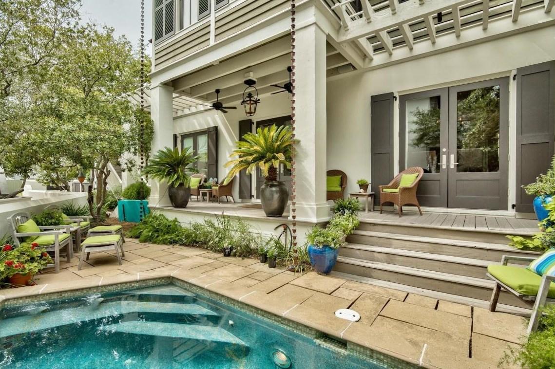 Located south of 30A in Rosemary Beach, this property proves that great things really can come in small packages. Interior design by prominent Atlanta designer Kay Douglass and thoughtfully planned property layout ensures you're getting the most out of this beach escape. Inside the main house you'll find the downstairs framed under an impressive pecky cypress ceiling while the rustic ''beach-chic'' kitchen complements the cozy living room. The entirety of the downstairs opens up to overlook the beautifully landscaped courtyard sporting a jetted private pool. In addition to the kitchen and dining rooms, you will find a spacious master bedroom with en suite bathroom and private entrance from the courtyard. Upstairs you'll find the same pecky cypress ceiling spread throughout and