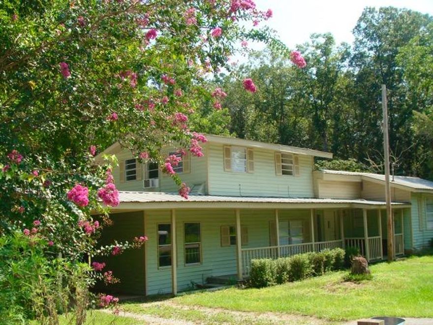 GREAT INVESTMENT PROPERTY -- This 3-4 BR, 2 1/2 bath house would make a great rental property or a nice single family home. Situated on a paved road in beautiful Euchee Valley on a spacious 1-acre corner lot with a creek running beside it. Kitchen has breakfast bar, refrigerator, dishwasher, stainless double sink, and smooth top electric range. Slate flooring in kitchen, dining room & foyer. Laminate flooring & ceramic tile floors in rest of house. Master Bedroom & Bath plus a half bath on first floor. Two bedrooms and full bath upstairs. There's a new well on the property. House is being sold As-Is. There is no survey. Buyer to do any needed inspections at buyer expense. Cash or Conventional buyer needed. No VA or FHA Financing, no 100% financing programs. No Seller Financing.