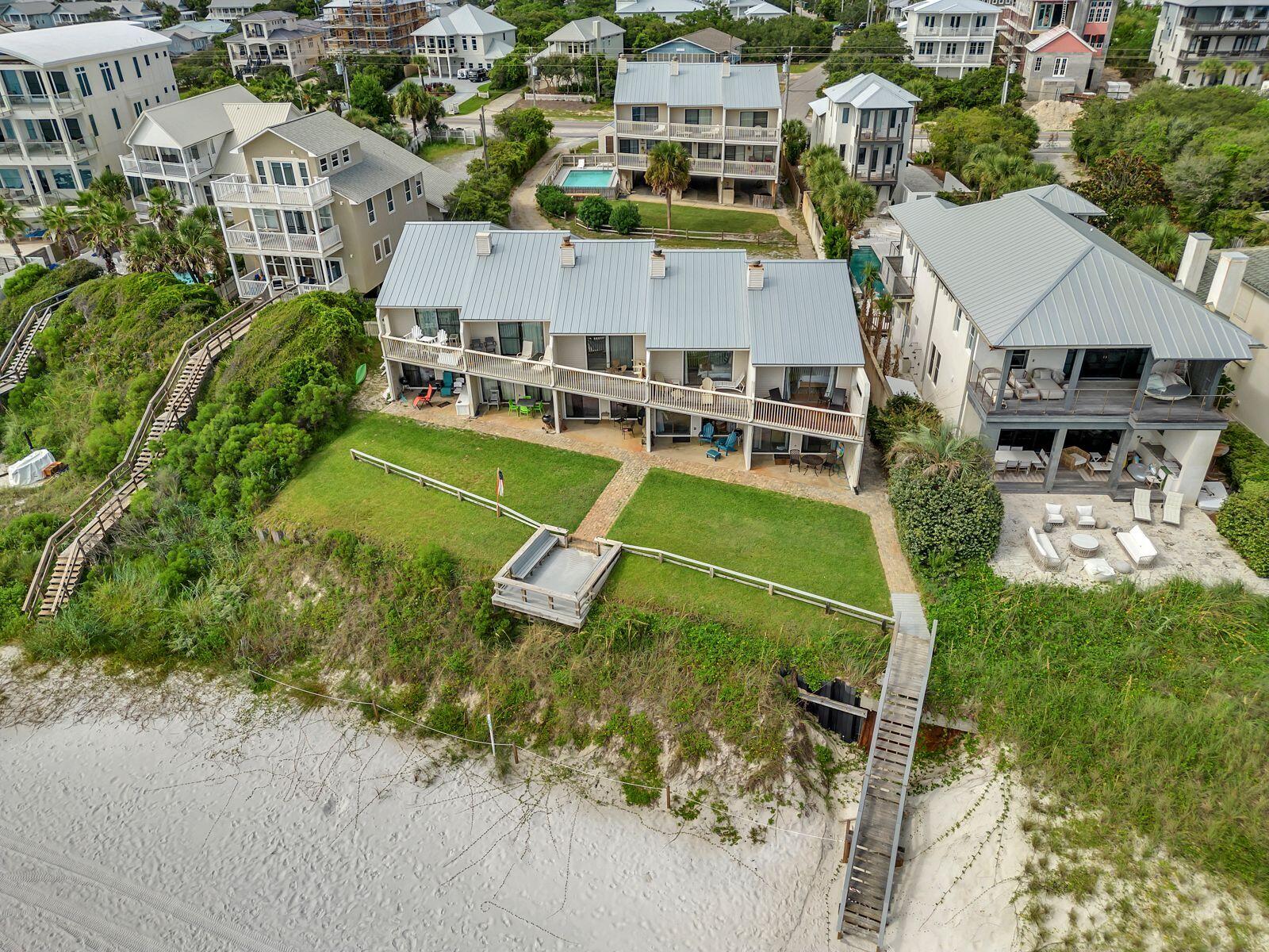 This is the hidden gem that you have been looking for! This beachfront townhouse is nestled in the perfect spot, just a short 5 minute bike ride to Alys or Rosemary Beach! Tucked away in Silver Sands Townhomes, a small community of just 8 units with a community pool and your own deeded beach! You will have plenty of room for your friends and family in this spacious 2 bedroom 2 1/2 bathroom unit. The property is set up to sleep 6 but there is room to add custom bunks under the stairs. The downstairs offers an open space for dining and entertaining along with a working wood fireplace. The downstairs patio off the living space is covered and has a hot and cold shower. Upstairs you will find an extra large Gulf front Bedroom