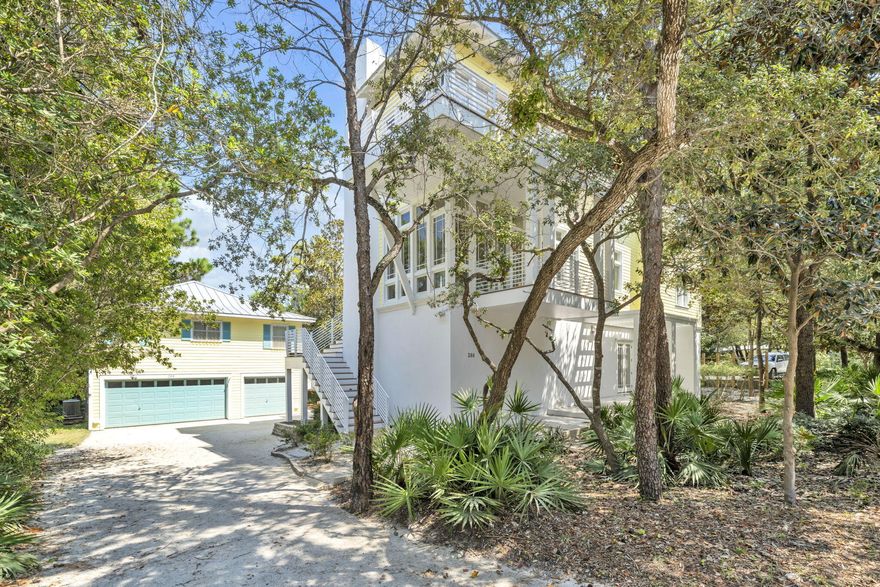 Nestled under Old Seagrove's iconic tree canopy and just two blocks from both the beach and Seaside, this three-story contemporary home (4645 sq-ft) blends architectural pedigree with coastal charm. Designed by acclaimed Tom Christ of Christ & Associates, a Seaside Prize-winning architect whose visionary work has shaped much of 30A's distinctive style.The main home delivers light-infused living with expansive covered porches and soaring floor-to-ceiling windows. On the first floor, you'll find a guest suite with private bath, walk-through laundry, and a massive unfinished flex space -- perfect for a future primary suite, media room, or game lounge.On the second floor, the open-concept living and dining area opens onto porches on both sides creating an ideal indoor-outdoor flow. A guest suite with a walk-in shower rounds out this level.
The third floor is a private retreat: the primary suite stuns with wall-to-wall windows, a private balcony, dual closets, and a spa-worthy bath with double vanity, garden tub, and walk-in shower. Plus, there's a second guest room with pre-plumbing area ready for an ensuite bath.
 Carriage House (781 sq-ft) 1 bedroom, 1 bath and a full kitchen, perched above a 2-car garage complete with a golf cart bay and 11 x11 air conditioned space. Ideal for multi-generational living, vacation guests, or rental opportunities.
Designed by a local design legend, this Seagrove gem offers the best of both worldssmart, stylish architecture and unbeatable proximity to the Gulf and Seaside's vibrant hub.***Buyer is responsible for personally verifying details about this Any information contained in this listing is believed to be accurate but not guaranteed.***
