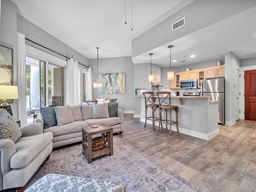 Gorgeous first level unit that lives large!  Located in the heart of Baytowne Wharf. This one bedroom residence features an open living area plus a den that is currently furnished as a bedroom with a queen sized bed, sleeper sofa in living room, raised ceilings, vinyl plank flooring throughout, stainless appliances, and a large covered patio and fenced yard adding outdoor living and entertaining space.  Beautifully decorated, nicely appointed and ready as your primary residence, second home or investment property!  Owners closet in unit as well as caged storage space.  Homeowners and guests at Sandestin enjoy first class amenities including the beach, pools, golf, shopping restaurants, entertainment and more!   Convenient shuttle service to the beach!