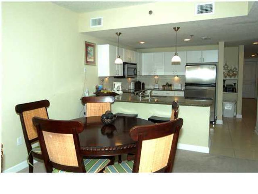 **ENJOY A GULF FRONT PROJECT WITHOUT PAYING A GULF FRONT PRICE** This 2BR/2BA+BUNK condo will sleep 8 comfortably and is located in Tower II of the Grand Panama Beach Resort. It is being offered fully furnished and ready to rent! Tower II is located across the street from the beach in the tower with the fantastic gym and another pool amenity, but this unit still offers nice GULF VIEWS from the balcony. And, owners in this tower still have access to all of the gulf front amenities and beach! This SAME FLOOR PLAN in Tower I recently SOLD for $275,000. MAKE AN OFFER - SELLER IS READY TO SELL