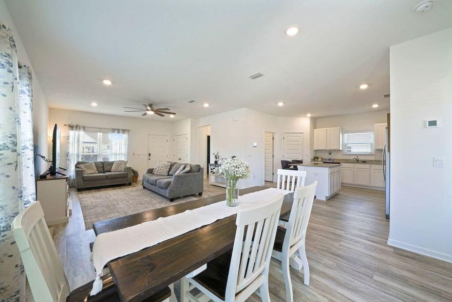 Sip your cup of coffee or sweet tea from one of the 2 covered patios at this spacious 4BR, 3BTH home in Owl's Head East! Step into an open concept floorplan with natural plus recessed lighting and LVP flooring. The heart of this home lies in its impressive kitchen and dining area which make a great space for entertaining or family gatherings! It features a large center island, white cabinetry with granite countertops, stainless appliances and a large pantry. The primary bedroom is on the main floor with an en suite bath including walk-in shower, double sink vanity and a large walk-in closet. The main floor also offers a laundry room with a washer and dryer, a second bedroom, or a great office space and another full bath! Up the stairs you'll find 2 more bedrooms and a third full bath! The double garage provides secure parking and storage, with the added convenience of back street entry. The A/C is a split unit, designed to separately control the heat and air on both floors and a water well has already been installed. Located just 8 miles from I-10 and approximately 16 miles to the gorgeous Emerald Coast beaches, you'll want to make this beautiful family home yours! You may choose to stay home, fish in the grass fed lake or take a stroll around the neighborhood park!