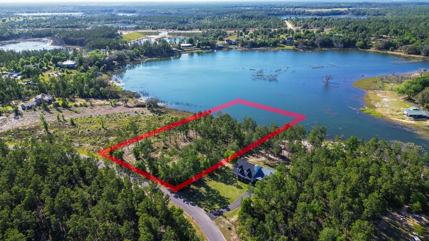 Looking for your own private slice of paradise? This 2-acre vacant lot on a lake is the perfect opportunity to create your dream home or cottage. Boasting 169 feet of lake frontage, you'll have stunning views of the water and plenty of space to enjoy all the activities that lakeside living has to offer.The property is just a short drive from Lynn Haven and Panama City. Located in a peaceful and serene setting, this property offers a rare opportunity to escape the hustle and bustle of city life and enjoy the tranquility of nature. Enjoy all kinds of water activities while taking in the scenic views. If you are looking to build a lakefront home, this is a must see! Pine Ridge Drive offers underground electric. A boundary and topographic survey from 2022 is included in the sale.