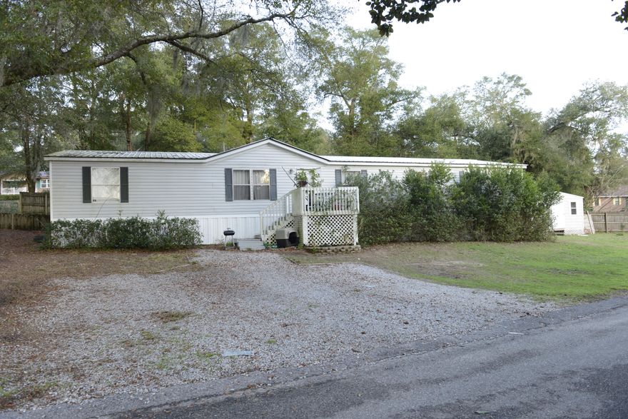 Large manufactured home hidden beneath the oak trees in the heart of Niceville. The house has a split room floor plan with three bedrooms on one side and the master bedroom located conveniently off of the dining room. The kitchen has a generous island and plenty of counter space for the ambitious cook. A den located off of the kitchen can be converted into a fifth bedroom. The backyard has a fire pit, and would make a great hangout with friends throughout the year. It is located on a 1/3 acre lot, just behind the Turkey Creek nature preserve, and is a short drive to several schools, shopping centers, and beaches.