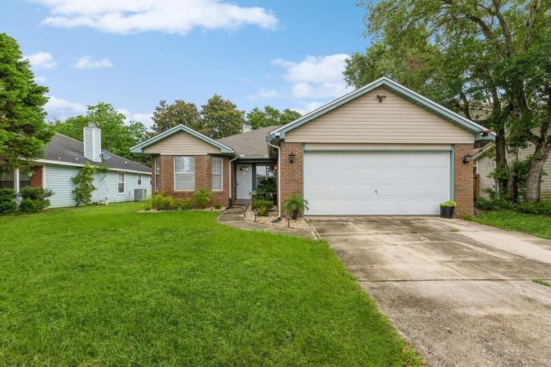 Don't miss this charming home located 1.5 miles west of Hurlburt Field. The home features a 2022 roof , 2021 hot water heater and stainless steel appliances. The kitchen offers plenty of storage with cabinets to the ceiling. A decorative skylight located in the living room allows for natural light. Ceiling fans are in each room. The flooring is a medium wood tone laminate with carpet in the 3 bedrooms. New brushed nickel door handles throughout, wood burning fireplace, double car garage, irrigation system with a new pump, and a screened in back porch with a privacy fence. No HOA. Seller allowance of $500.00 for carpet in main bedroom. Seller will need to rent back up to two weeks after closing. Fridge in garage, sec. cameras, and potted plants do not stay