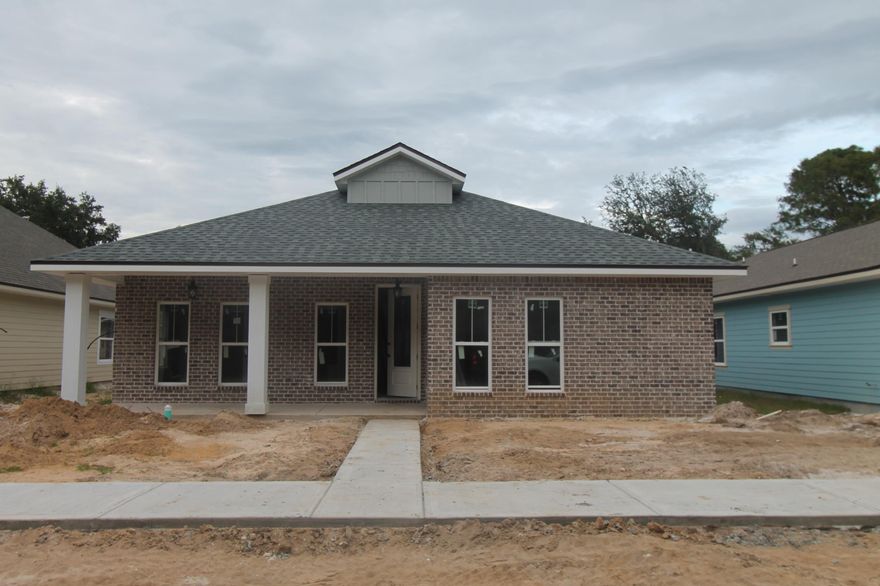 Introducing ''Temple Park at Port Dixie'', a 40 lot development is Shalimar with both underground utilities and broad sidewalks. This 4BR/4BA custom brick homesite consists of the main home being a 3/3 (2070 SF), then a separate 1/1(448 SF) cottage/ mother-in- law suite or game room with kitchenette, that is connected by a breezeway with courtyard. There are 10 Ft. ceilings w/ impressive crown molding, LVP flooring throughout most of the home, tile in the master bath, and 5 1/4'' baseboard throughout.