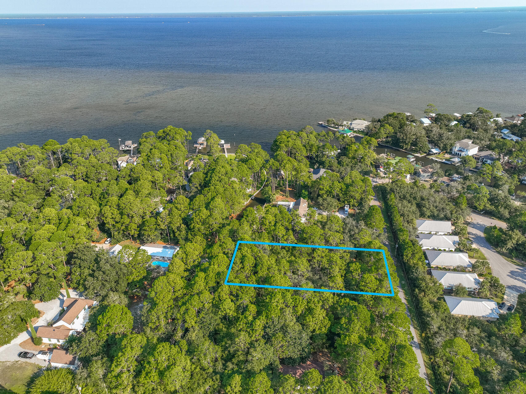 Exceptional Waterfront Opportunity - Spacious Canal Lot with Dock Permit and House Plans!This rare offering presents over half an acre of prime waterfront land just 750 feet from the expansive Choctawhatchee Bay, situated on a tranquil, low-traffic street. With the potential for your dream coastal home, this property comes complete with approved inland cut dock permits and thoughtfully designed house plans, streamlining your journey to life on the water.This lot is ideal for creating a private waterfront retreat or an expansive estate with direct bay access. Don't miss the chance to secure a slice of waterfront paradise with versatile options for future growth and enjoyment.