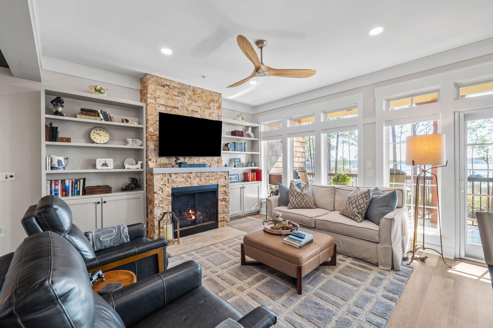 This beautifully remodeled first-floor corner condo is a showstopper! It is situated in the Dawn building at Lakeside Lodge within the gated Wild Heron community. Its highly desirable location offers direct, unobstructed views of Lake Powell. The open floor plan allows for immediate lake views upon entering, with modern finishes throughout, heated tile floors in the primary bathroom and a gas fireplace. The condo has been updated with a custom hutch and pantry, the utility area now features a new sink and cabinet, and new flooring has been installed in all bedrooms and closets. The dishwasher was replaced in 2023, while the refrigerator, range, and oven were replaced in 2024. The garbage disposal and kitchen faucet were updated in 2023, and a new retractable screen door was installed for the deck. The HVAC system was upgraded with a dehumidifier and a new hot water heater was installed in 2023 and both have been recently serviced. Residents of Wild Heron enjoy access to a dock, fitness center, pool, hot tub, and boardwalks. The community offers well-maintained common areas and a peaceful lakeside setting. New assessment has been paid in full, and CDD bond has been paid off. 